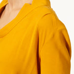 Top JEROME Jaune en voile viscose laine. Manches longues à poignets boutonnés. Blouse à col rond.